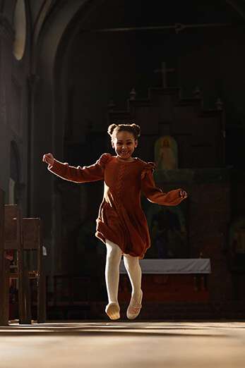 Child running around in the church