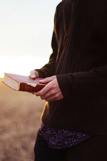 Person holding Bible