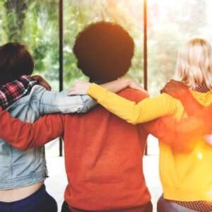 5 Kids Embracing Each Other And Fill With Joy And Happiness In Front Of A Day Light